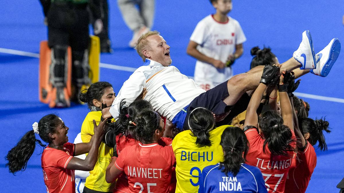 The Indian women's hockey team celebrates its historic Asian Games gold medal victory in Japan.